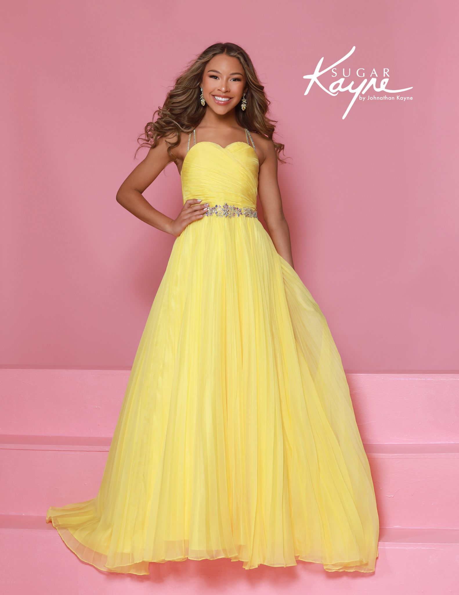 Full-length yellow pageant dresses for girls with ruched bodice and pleated chiffon skirt, featuring sparkly waistband and spaghetti straps.